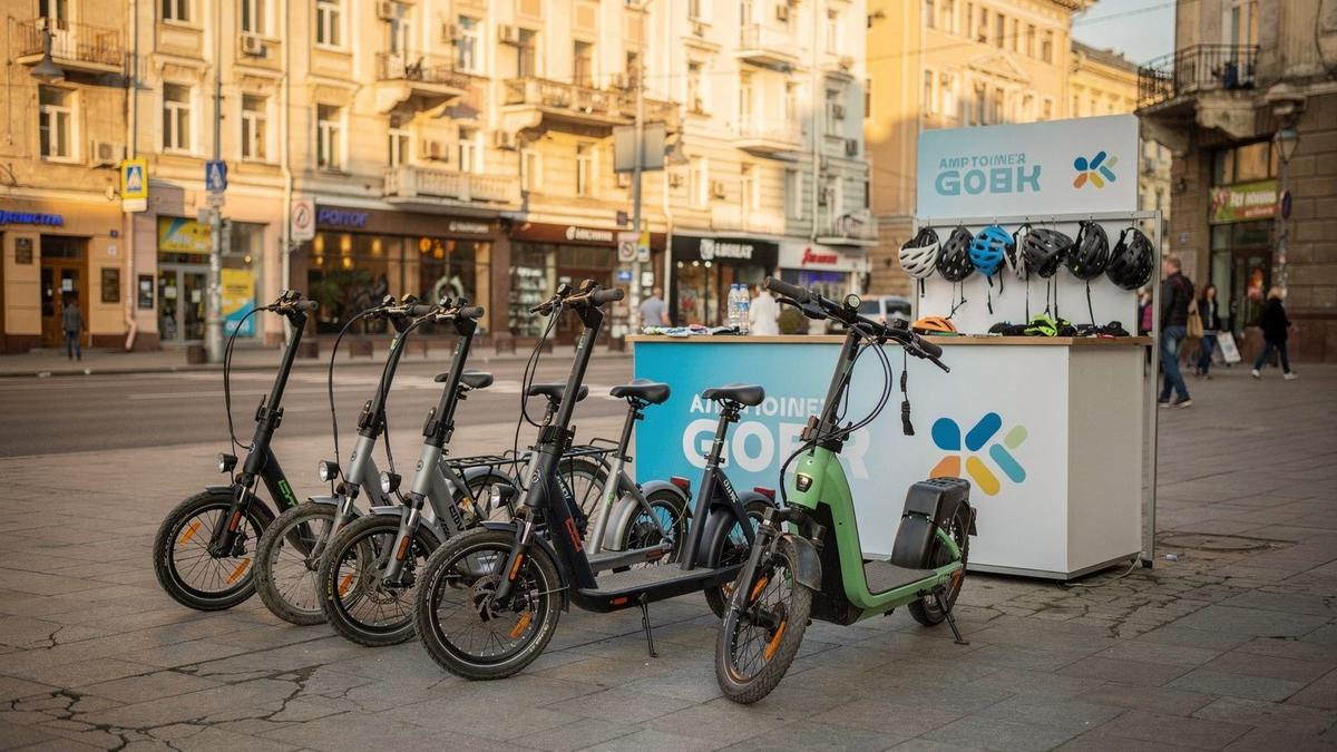 Scooters and e-bikes parked in a row outside the rental counter on Khreshchatyk Street in Kyiv